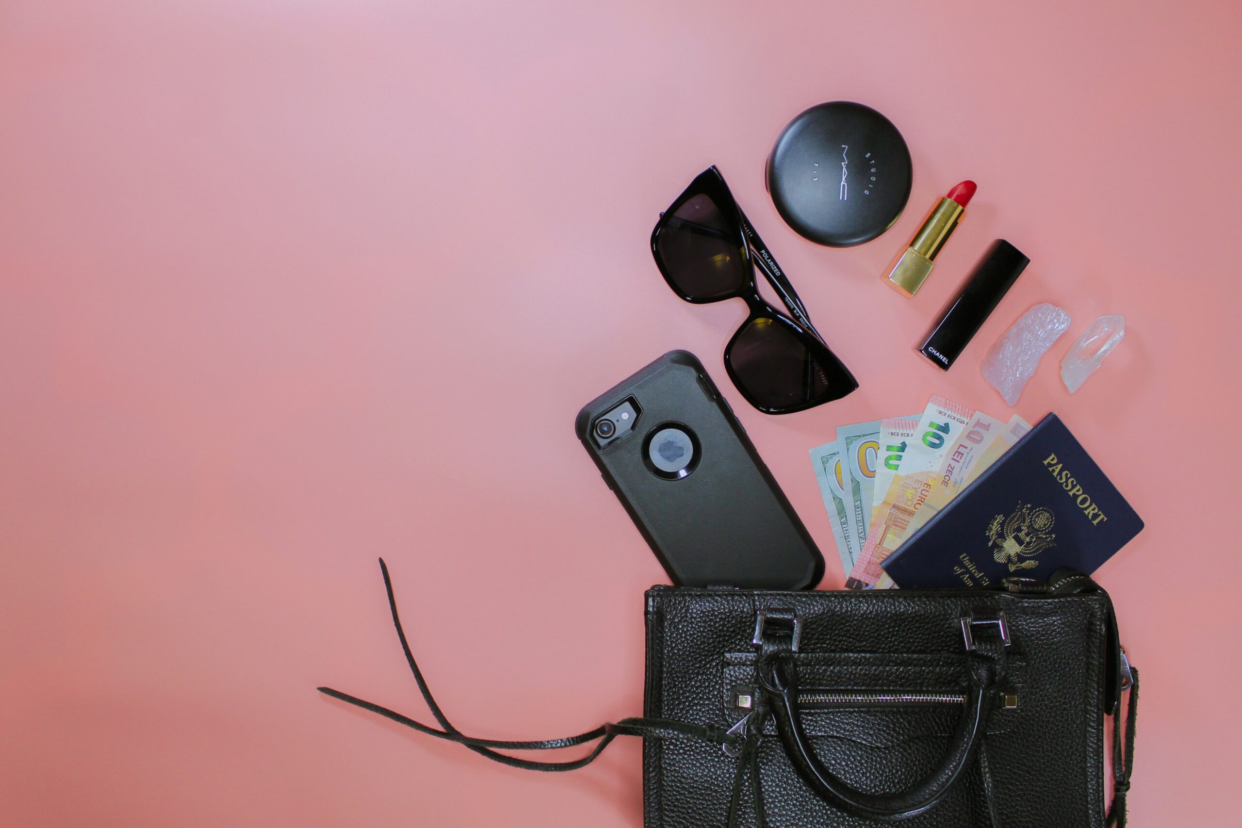 black sunglasses on black leather pouch